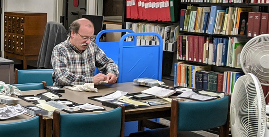 volunteer_librarian_William_Doering_works_to_help_recover_wet_AV_material_550px.jpg